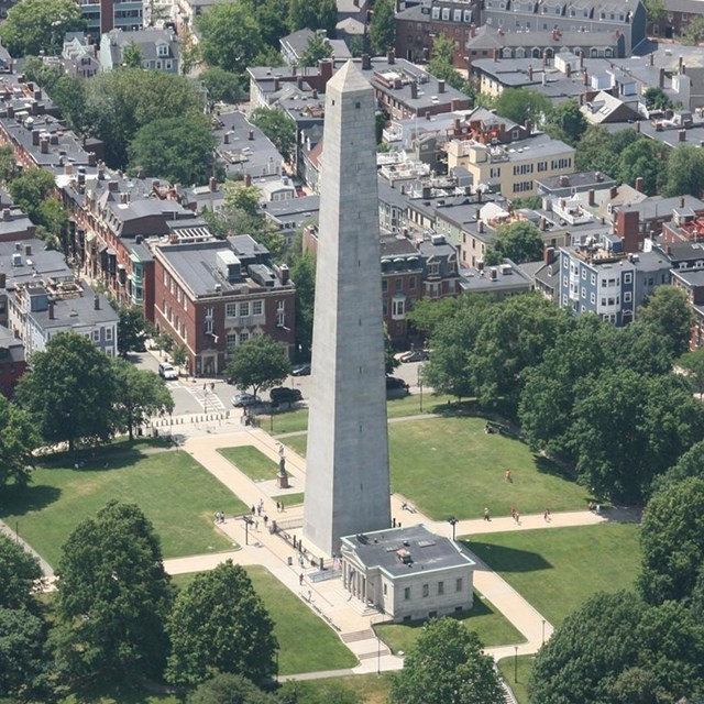 An aerial photograph of the large obelisk that is the Bunker Hill monument