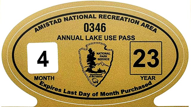 Photo of Annual Lake Use Pass stickers with large oval for boat and smaller rectangle for trailer.