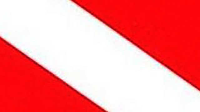 Man-down flag, which is a red flag with broad, white, diagonal line