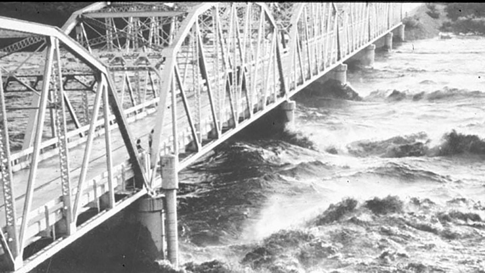 Floodwaters from Hurricane Alice smashing against the Highway 90 bridge.