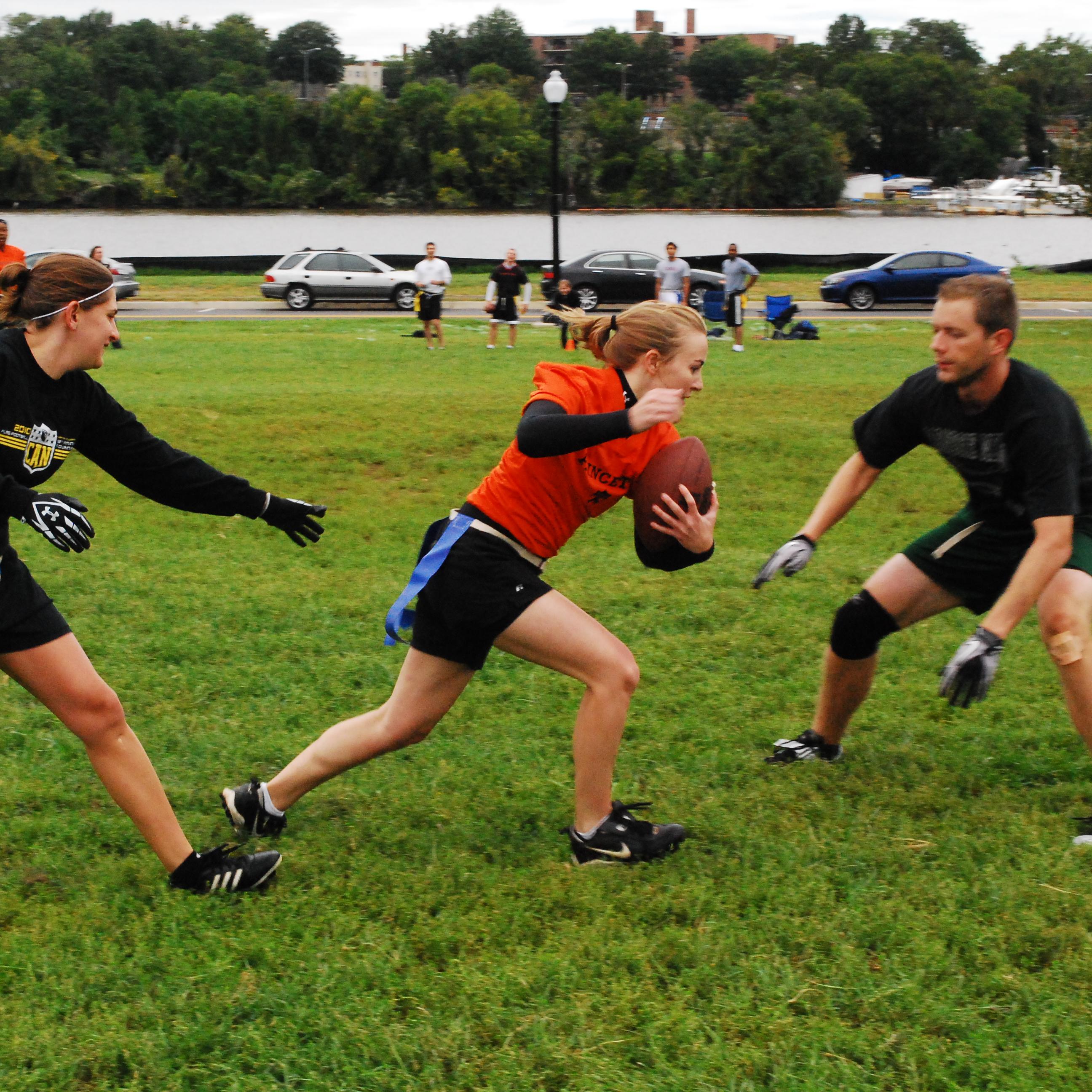 A group plays flag football