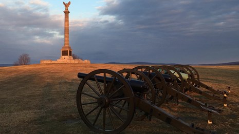 NY State Monument with Cannon at Sunset