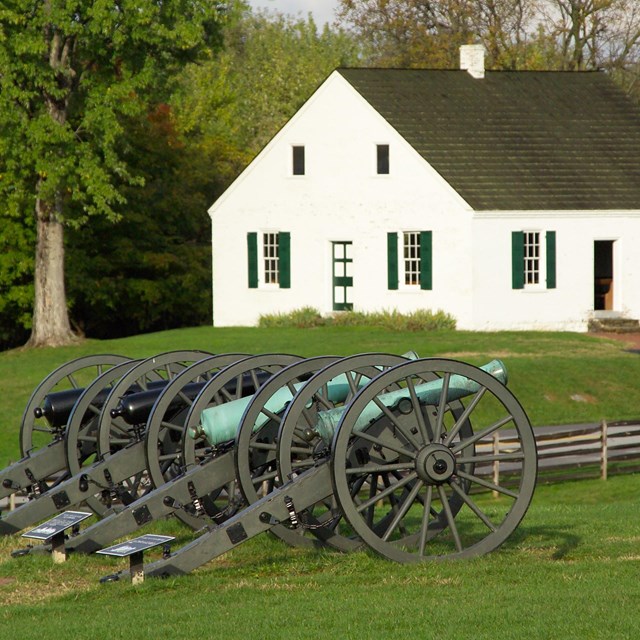 Four cannons on display in front of the Dunker Church