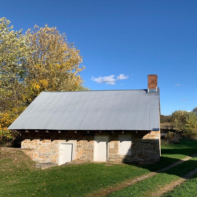 Roulette Spring House-stone structure with metal roof