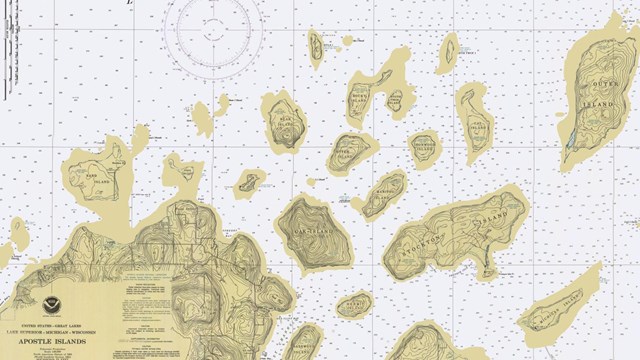 A topographic map of 22 islands of different shapes and sizes in Lake Superior. 