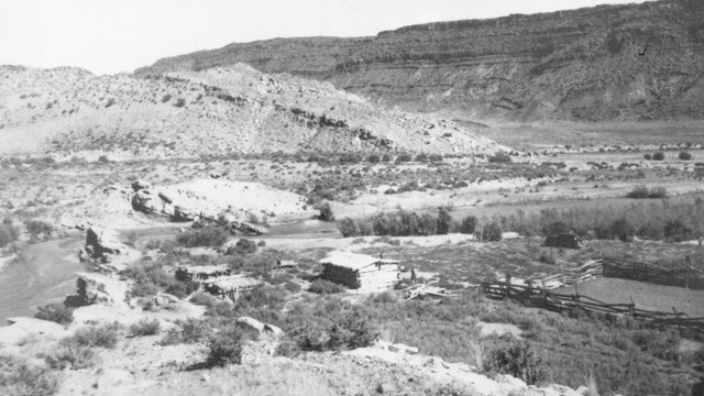 Photograph of Wolfe Ranch National Register District. View of the cabin, corral, and food cellars. 