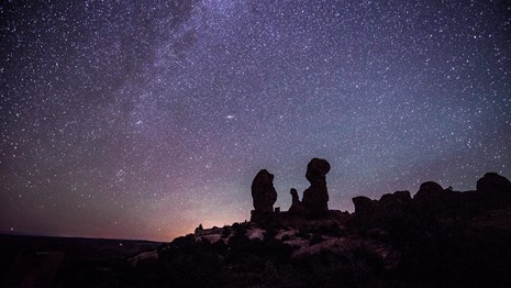 rock pinnacles with the milky way overhead