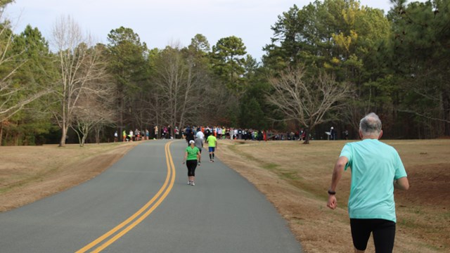 Runner moves toward start of marathon. 