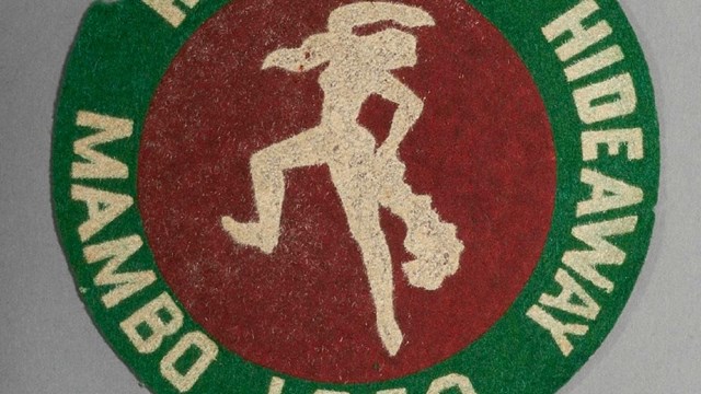 A circular patch reads “Hernando’s Hideaway Mambo Loco” in all caps.