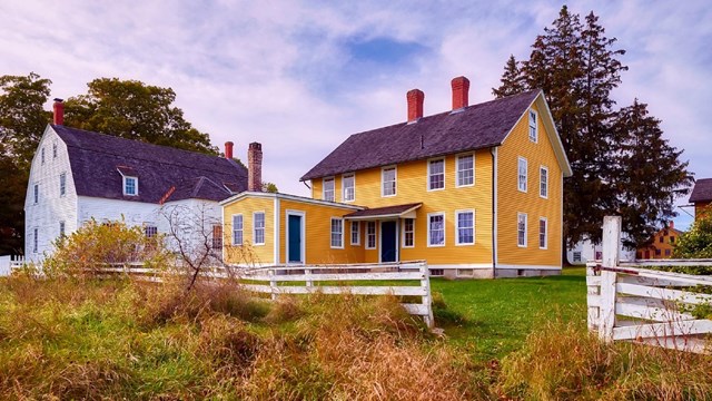 Photo of historic structures in a pasture. 