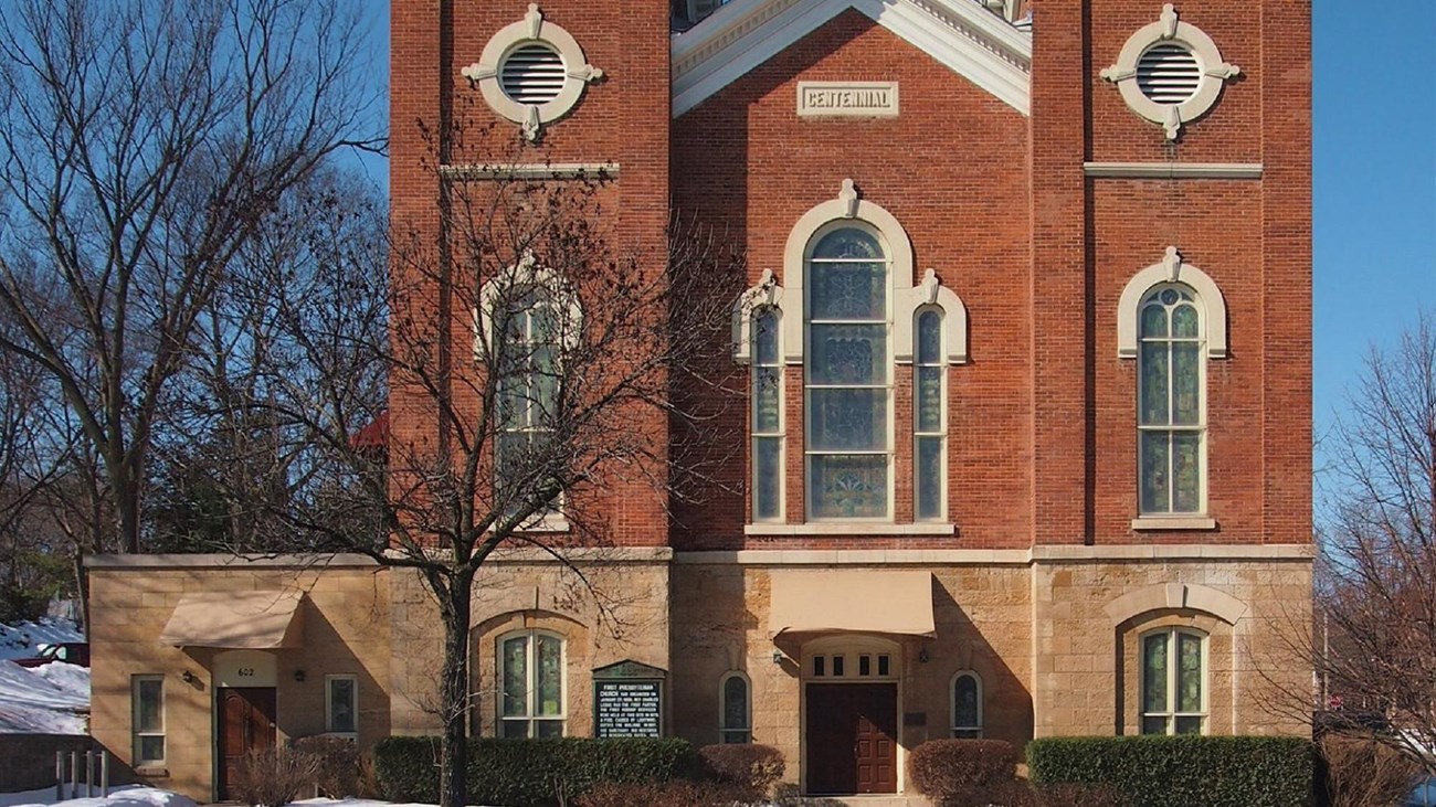 Brick church with two steeples. Photo: by McGhiever, CC BY-SA 4.0