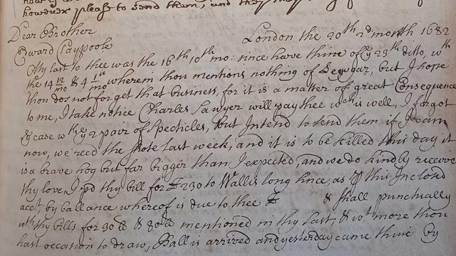 black inked handwriting on yellowed book page