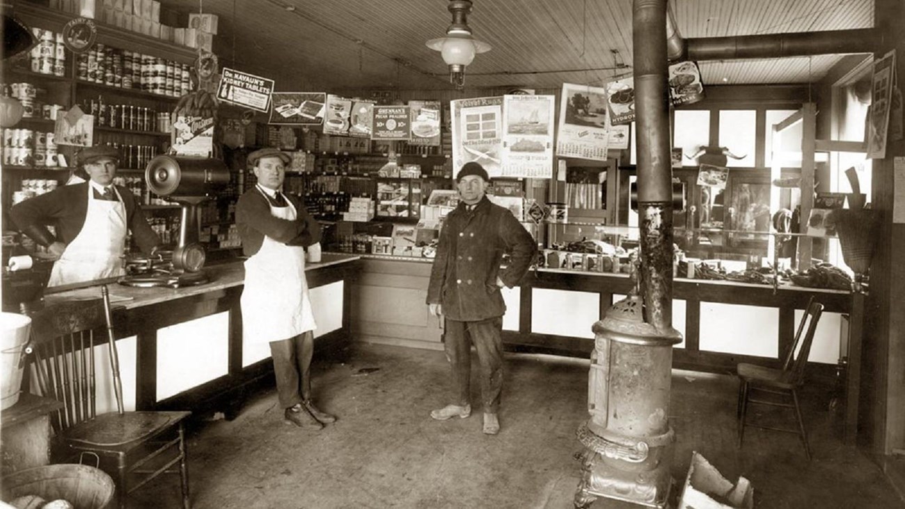 Men stand in general store