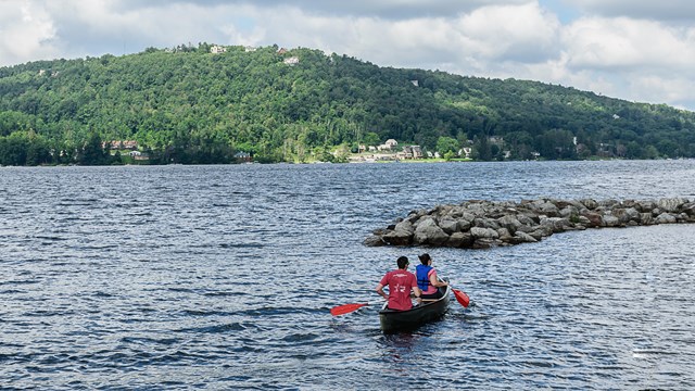 Canoers on a wide river 