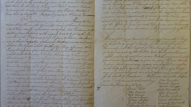 Two yellowed, folded pages filled with cursive.