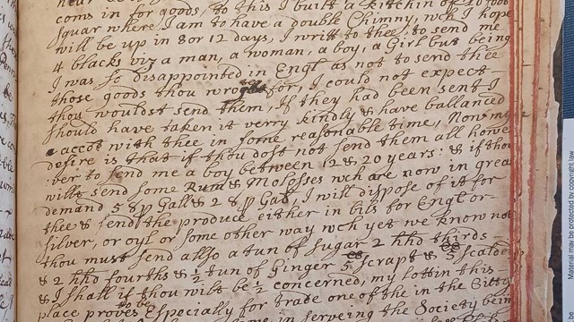 black inked handwriting on aged book page