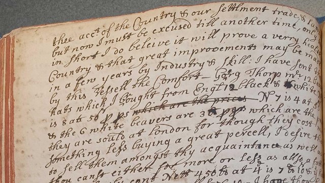 black ink handwriting on aged book page