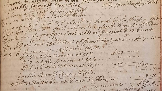 black ink handwriting on aged book page