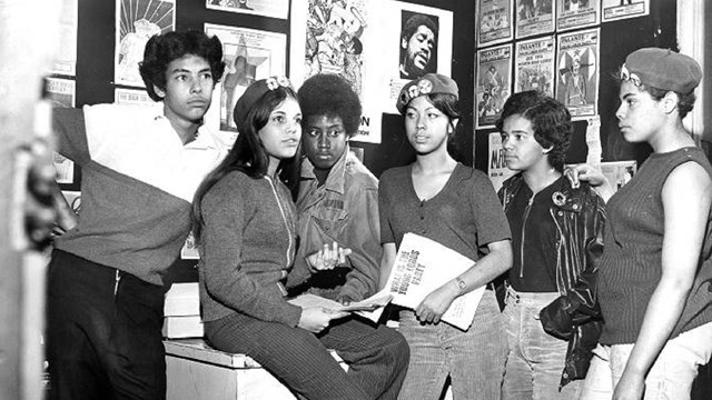 Six Young Lords members pictured hanging out.