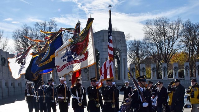 US Color Guard reviews at the WWII Memorial to commemorate the 80th anniversary of Pearl Harbor