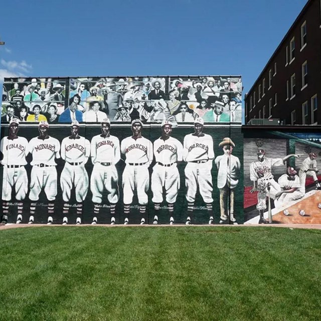 mural of all black baseball team painted on side of a baseball field