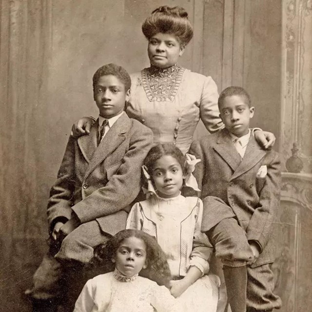 sepia image of a black family in Victorian dress