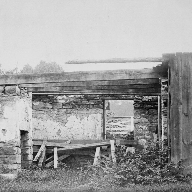 Stone summer kitchen on grounds of 