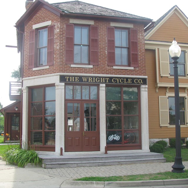 Photo of the exterior of a two-story brick building. 