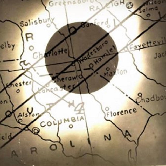 Image of an eclipse shadow across a map. 