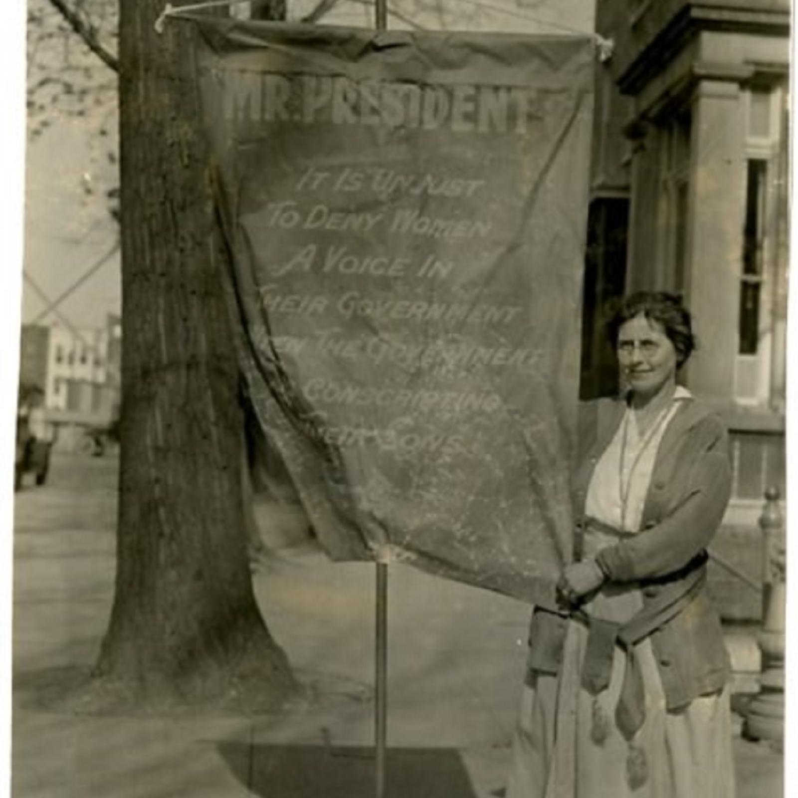 Woman holding a protest sign