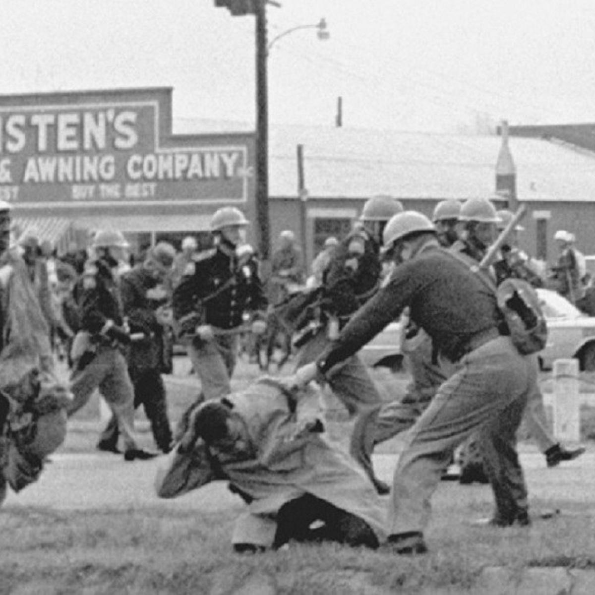 Police officers beating protesters