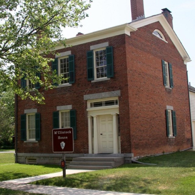 Two-story brick house. 