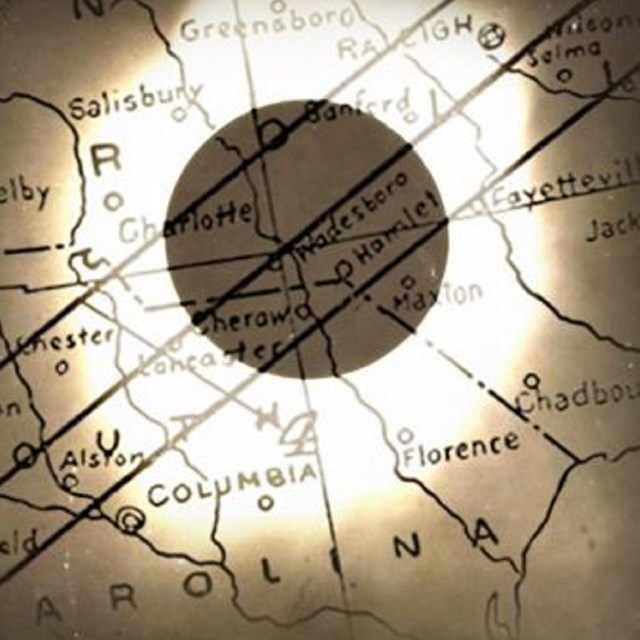 Image of an eclipse shadow across a map. 