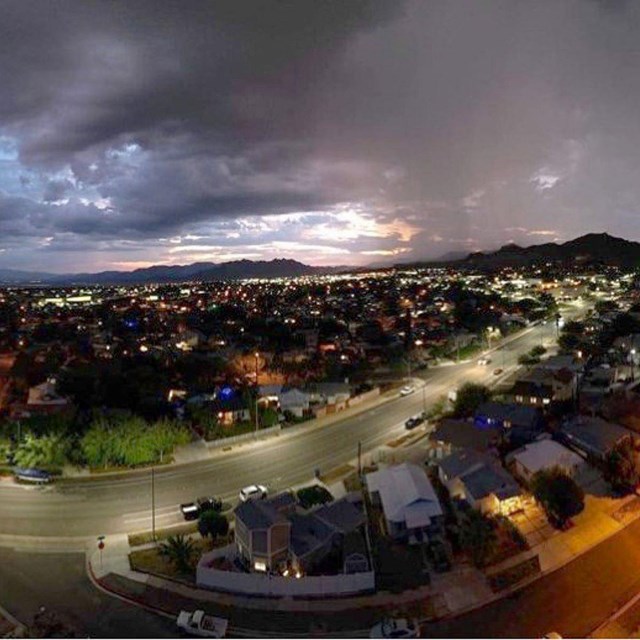 an aerial shot of a neighborhood at twilight