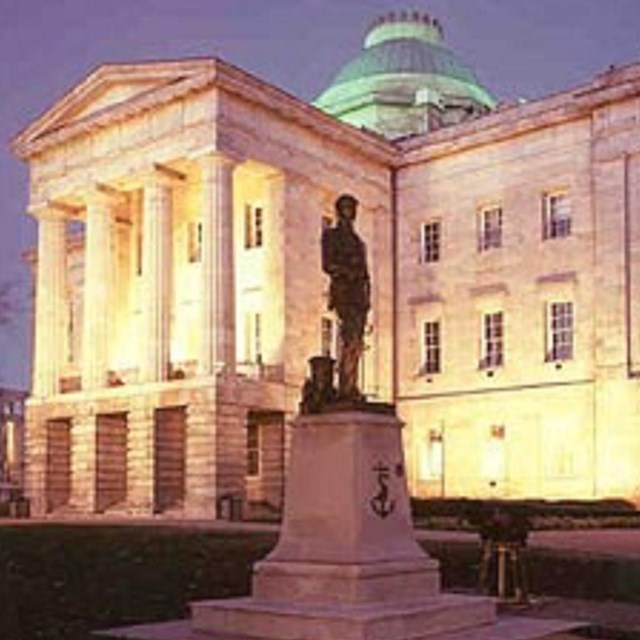 Federal building with statue out front. 