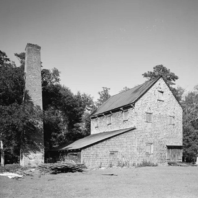 Greyscale photo of a two story building