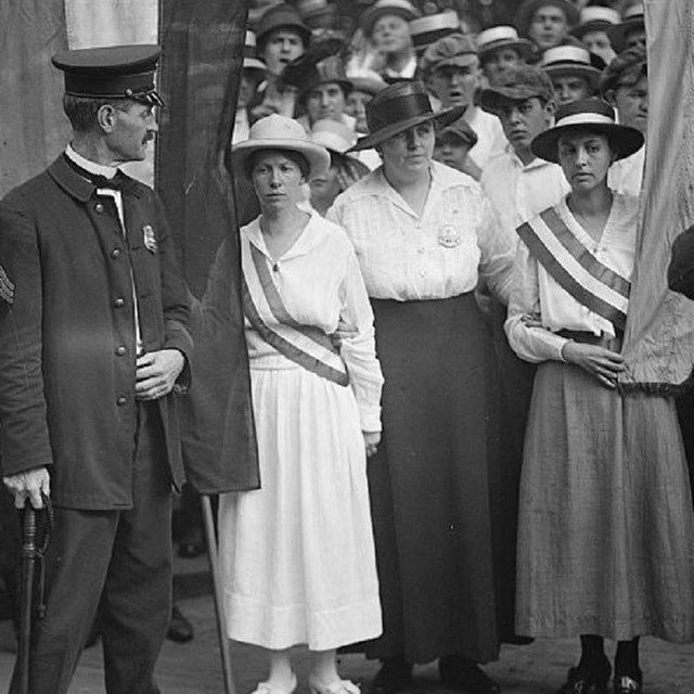 Group of suffragists picketing. 