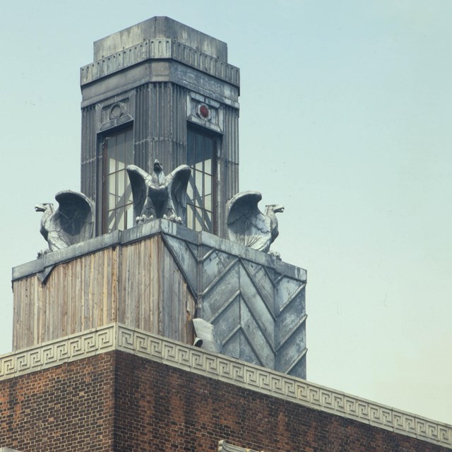 Photograph of Art Deco tower with eagle sculptures