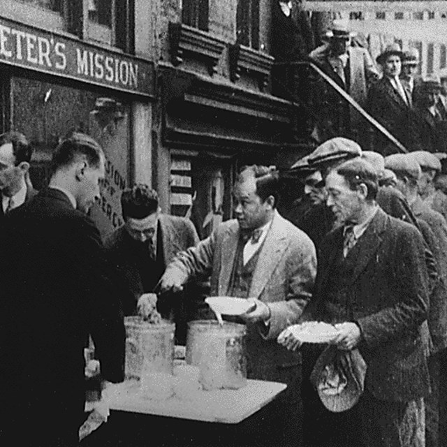 Photo of men in a breadline during the Great Depression