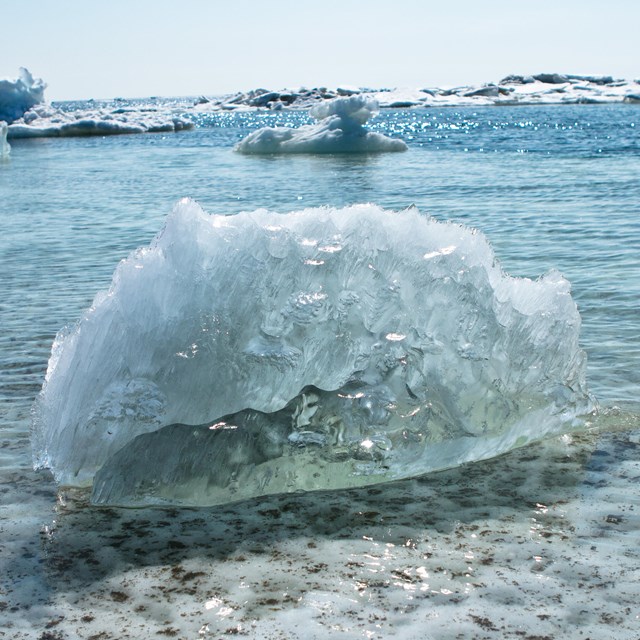 A chunk of ice on shore. 