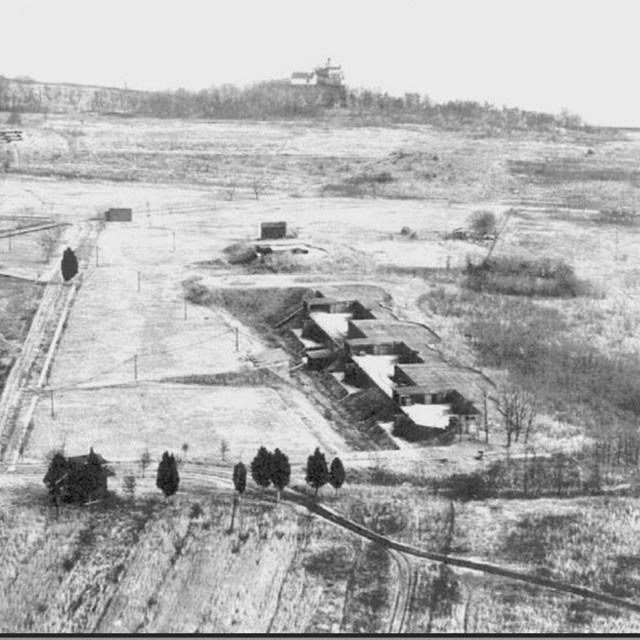High angle view of a fort landscape with a row of batteries, black and white.