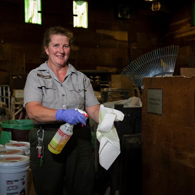 Irene at work in a storage area at Acadia