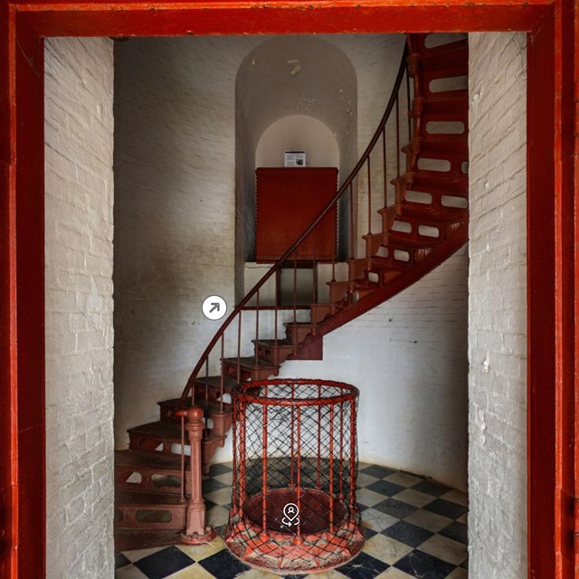 entryway to lighthouse with red spiral staircase