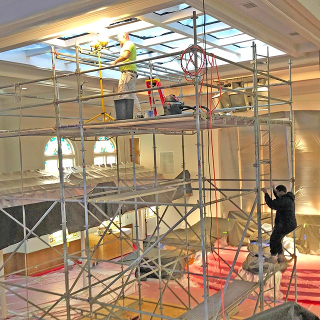 Scaffolding in a brightly lit church sanctuary