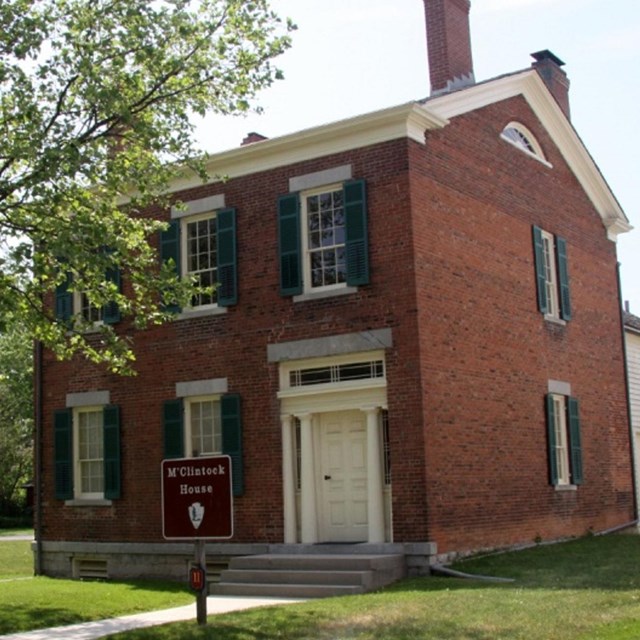 Two-story brick house. 