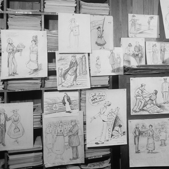 Woman standing in an office with cartoon drawings on the walls all around