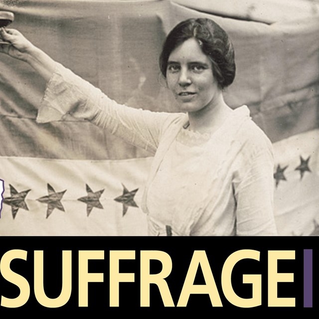Alice Paul holding up a glass in front of ratification banner