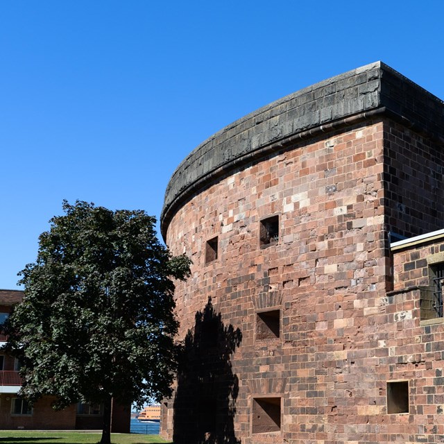 Exterior view of Castle Williams (brick building) on Governors Island, New York