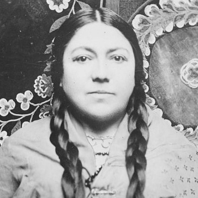 Marie Bottineau Baldwin in traditional Chippewa dress with braided hair