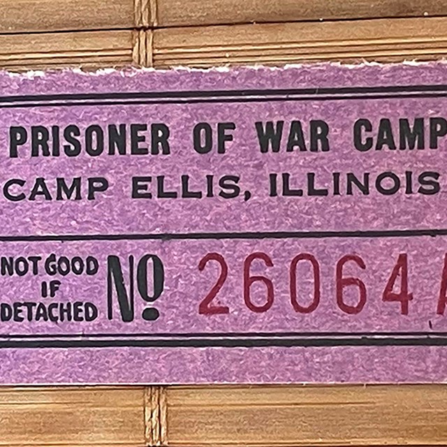 Small purple coupon or chit from a POW camp. Value 5 cents